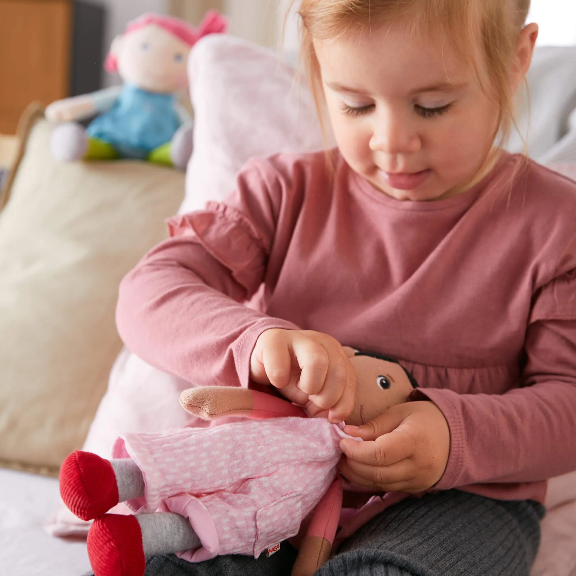 Snug Up Doll Rumbi: Soft Baby Doll with Removable Overalls and Pocket