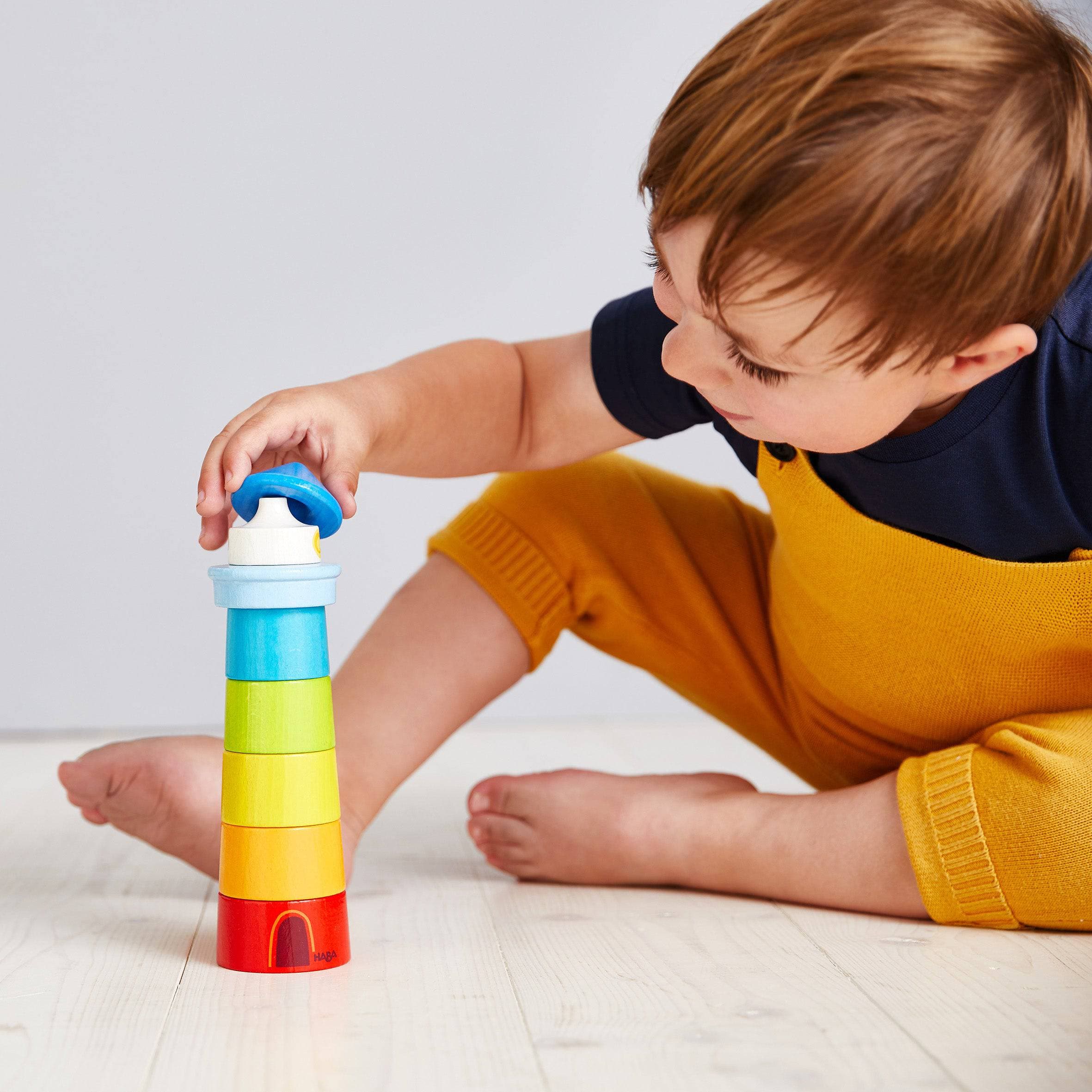 Lighthouse Stacking Game Wooden Rainbow Stacker by HABA